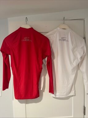 O'Neill Two-Pack Long Sleeve Rash Guards - Red & White. Both for $20.